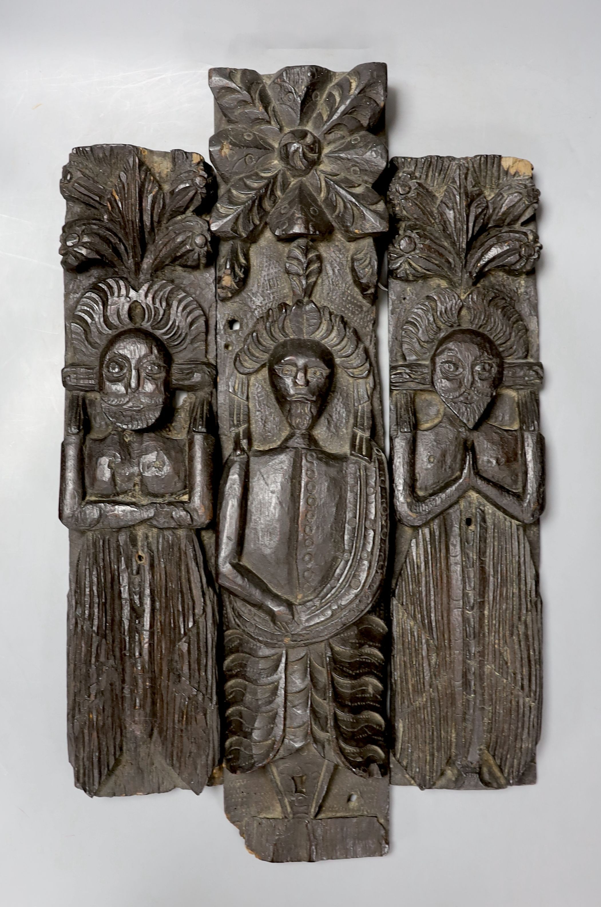 Three 17th century carved oak terminal figures - tallest 51.5cm